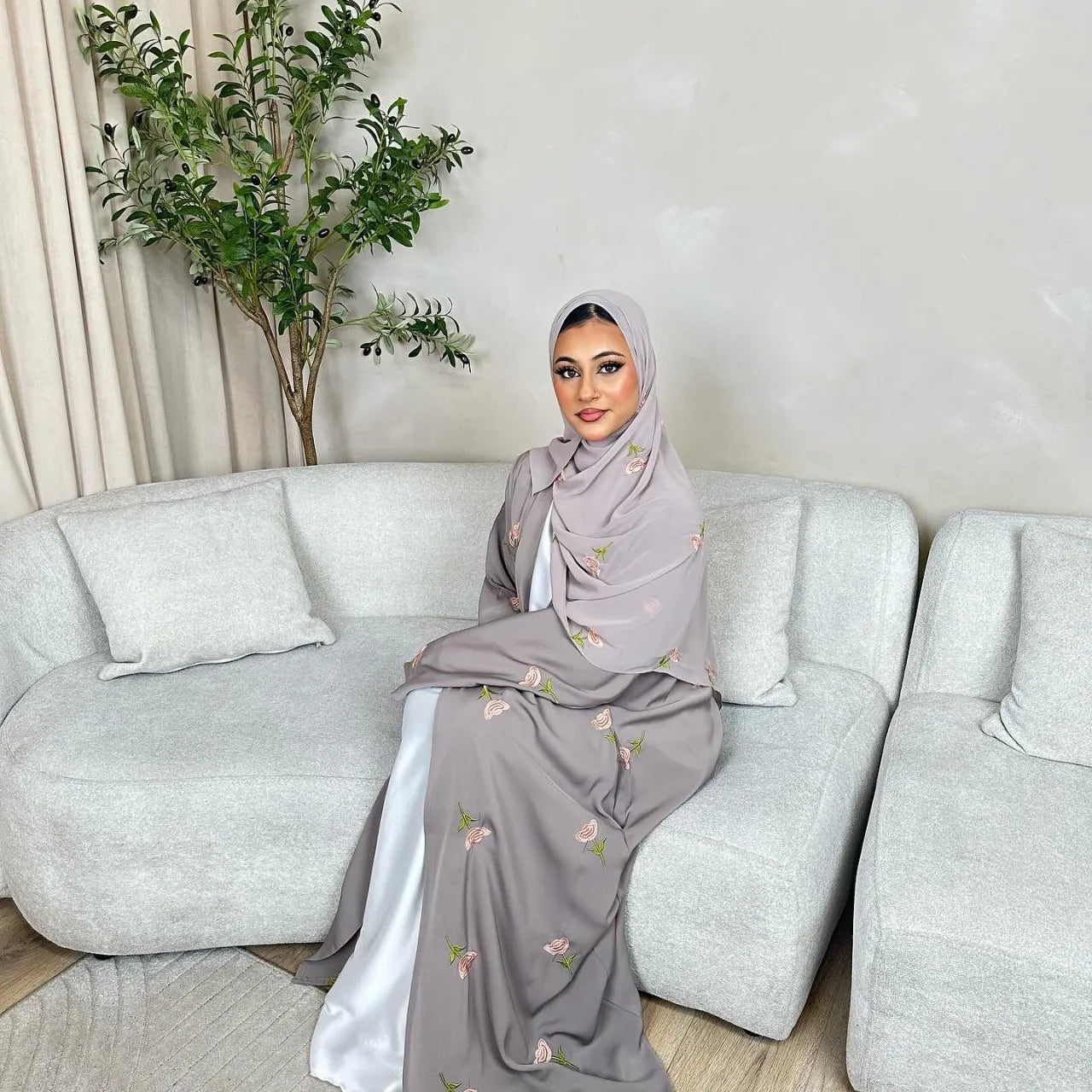 Model wearing The Maison Brodee in gray with matching hijab