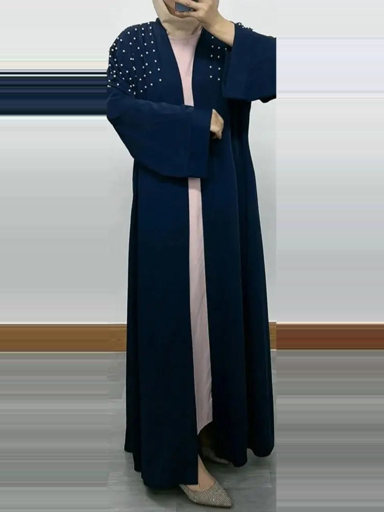Navy blue pearl-detail open kimono abaya worn by a model, full length